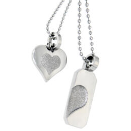Partner pendant made of stainless steel, with a rough heart indentation