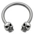 Side horseshoe piercing with skull motif