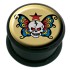 Plastic picture plug with a skull and wings motif