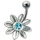 Belly button piercing with a large flower design