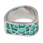 Steel ring with turquoise colored acrylic areas