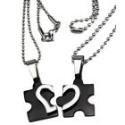 Partner pendant "Puzzle with a heart motif on the front" made of black PVD-coated stainless steel with an individual engraving 