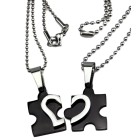 Partner pendant &quot;Puzzle with a heart motif on the front&quot; made of black PVD-coated stainless steel with an individual engraving 
