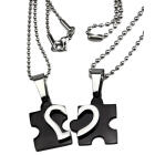 Partner pendant "Puzzle with a heart motif on the front" made of black PVD-coated stainless steel with an individual engraving 