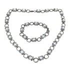 Necklace with bracelet made of stainless steel with clear zirconia.