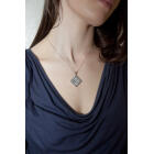 Diamond shaped pendant with lots of clear crystals