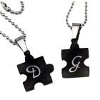 Partner pendant &quot;Puzzle with a heart motif on the front&quot; made of black PVD-coated stainless steel with an individual engraving 