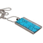 Stainless steel pendant with striking turquoise inlay