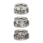 Partner rings made of smooth stainless steel with a divided engraving of your choice