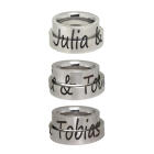 Partner rings made of smooth stainless steel with a divided engraving of your choice
