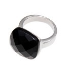 Steel ring with a black synthetic stone in black